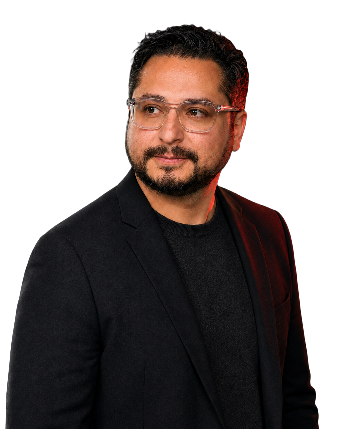 Edwin Mata wearing glasses and a black jacket